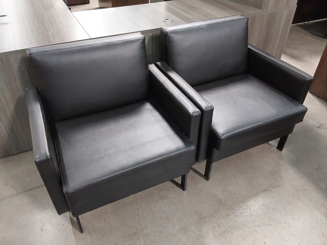 Preowned Black leather club chairs